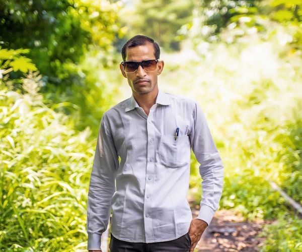 Man standing tall and confident outdoors